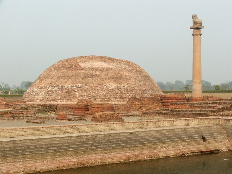 View on a section of Jetavana Monastery, Sravasti, India, showing a collection of smaller stupas, with more large structures in the background.