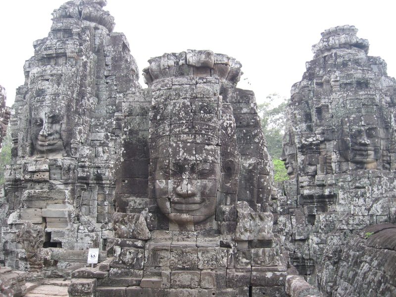 Carved faces on a tower at the Bayon, Angkor, Cambodia.