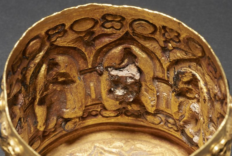 Detail view of the container's lid with the inscriptions.