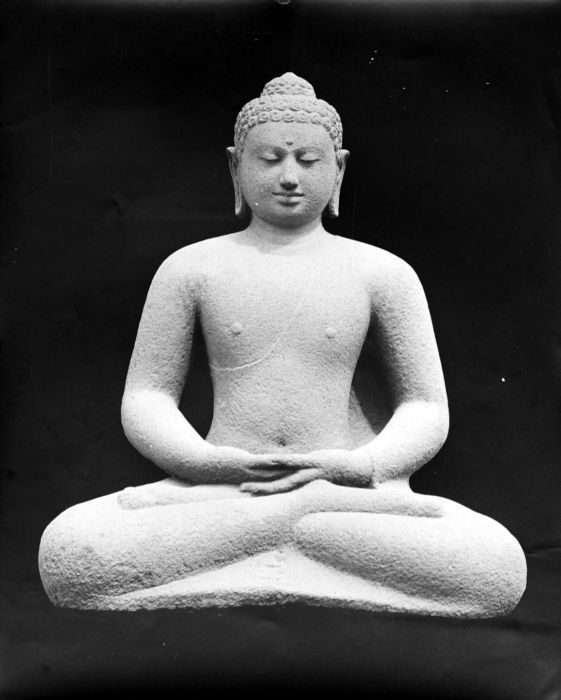 Buddha sculpture from the Borobudur, representing Dhyani Buddha Amitabha.