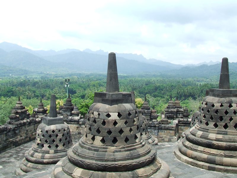Perforated stūpas on the three upper, circular terraces of Borobudur.