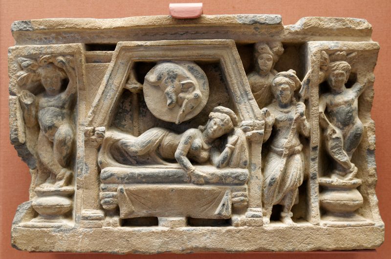 Stupa drum panel showing the conception of the Buddha: Queen Maya dreams of a white elephant entering her right side, 100–300 CE, carved schist, Jamal Garhi.