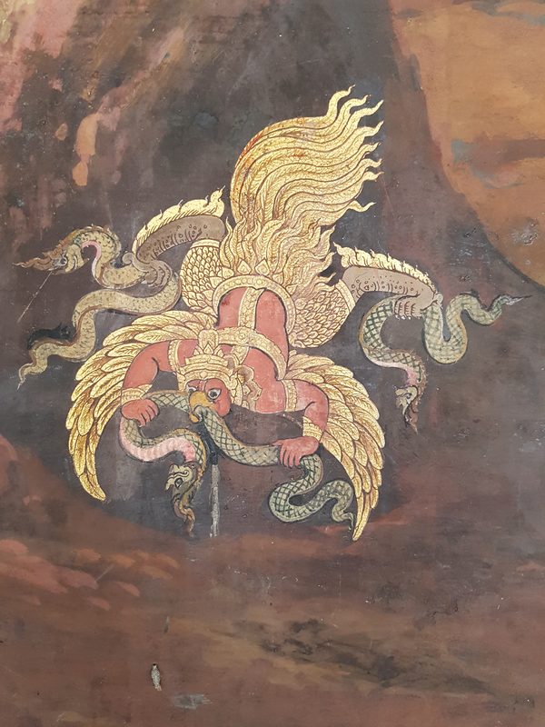 Garuḍa devouring Nāga, at Wat Phra Kaew, Bangkok, Thailand.