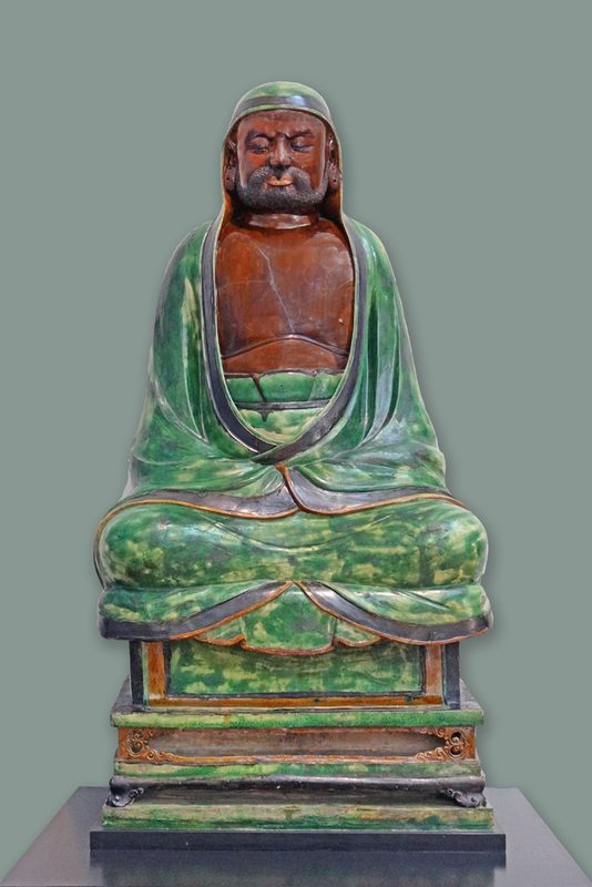 Life-size sculpture of the seated Bodhidharma Ming dynasty, North China, stoneware with green and brown glaze, 1484.