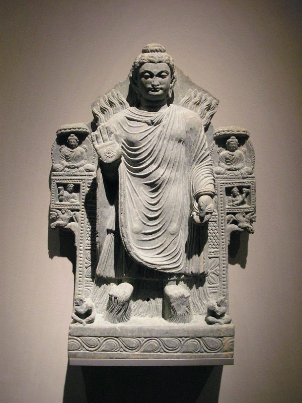 Shakyamuni Buddha in the pose of demonstrating control over the fire and water elements, Gandhara, 3rd century CE.