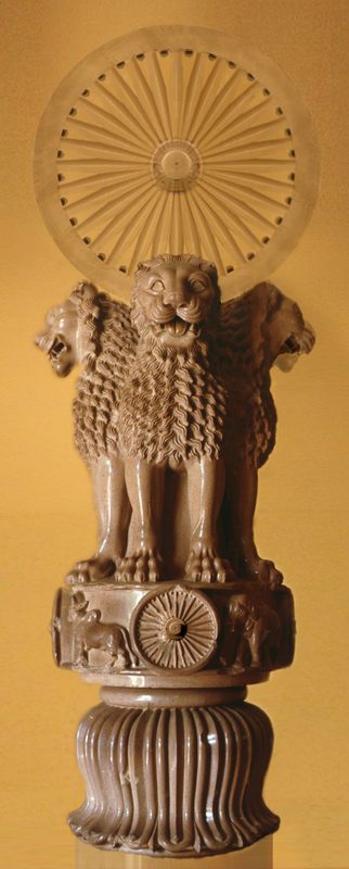 The Lion Capital of Ashoka in Sarnath, showing its four Asiatic lions standing back to back, and symbolizing the Four Noble Truths of Buddhism, supporting the Wheel of Moral law.