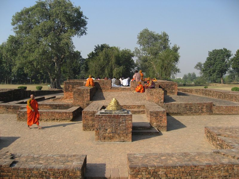 View on a section of Jetavana Monastery, Sravasti, India, showing a collection of smaller stupas, with more large structures in the background.
