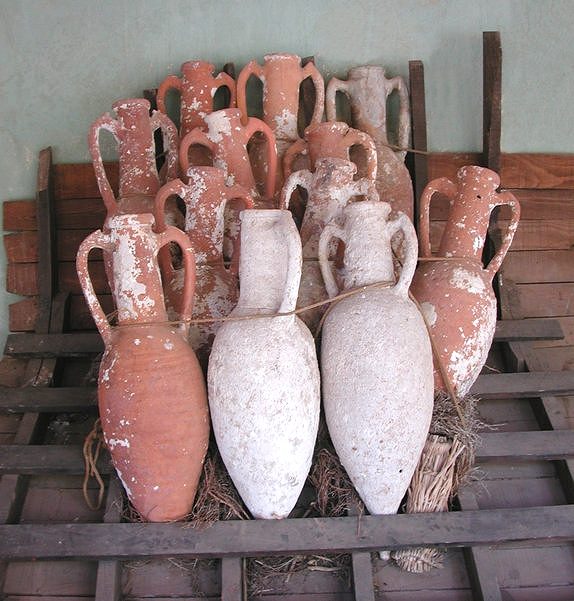 Amphora like these, designed for marine transport, facilitated the trade of wine and other goods. They served as standardized containers for liquids and dry goods, ensuring safe transport and storage.
