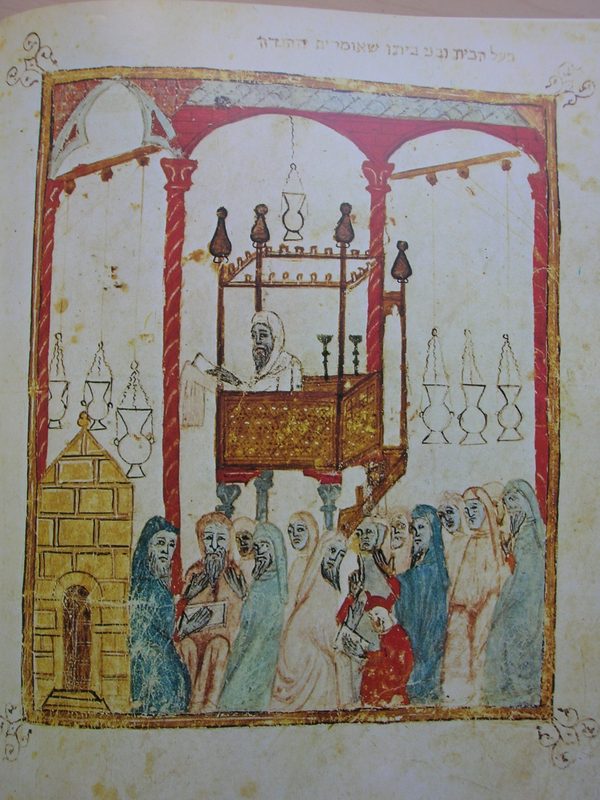 Image of a cantor reading the Passover story (also called Pesach, is a major Jewish holiday and one of the Three Pilgrimage Festivals; it celebrates the Exodus of the Israelites from slavery in Egypt) in Al-Andalus, from the 14th century Haggadah of Barcelona.