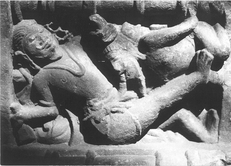 At the Lakshmana temple in Khajuraho (954 CE), a man receives fellatio from a seated male as part of an orgiastic scene.