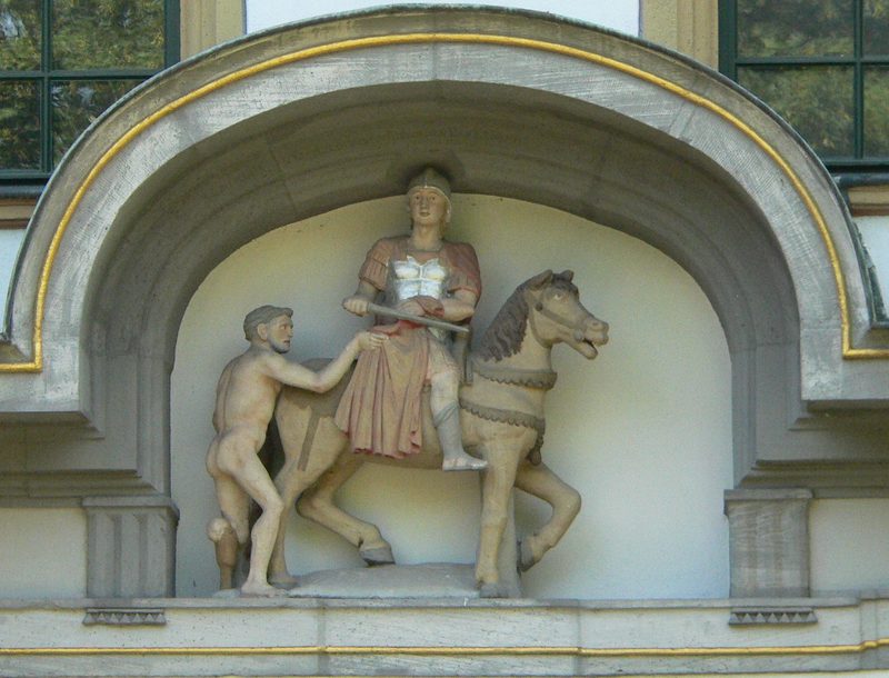 St. Martin sharing his coat, sculpture in an archway in Frankfurt am Main.
