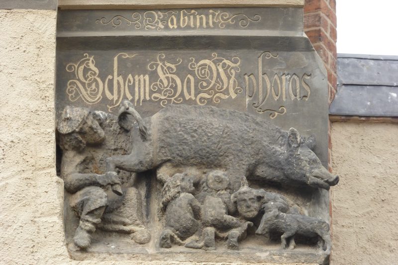 'Judensau' relief on the south-east wing of the town church in Wittenberg.