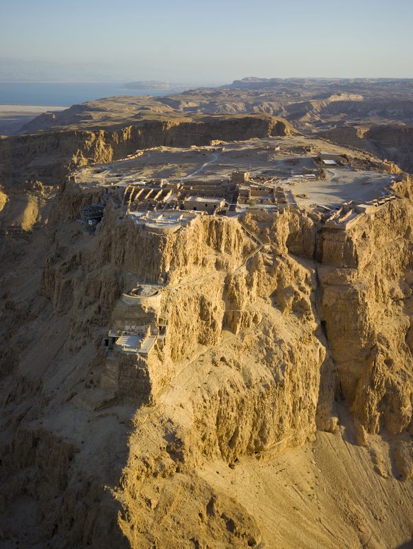 Masada with the Dead Sea in the background. Masada is an archaeological site in the southern district of Israel. Herod had a palace fortress built on a summit plateau on the edge of the Judean Desert, high above the Dead Sea. This royal retreat was completed around 15 BCE. Herod was the (puppet) King of Judea from 37 to 4 BCE and played a key role in the biography of Jesus.