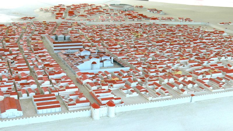 Ideal reconstruction of the civil city around 210 AD, in the center the Forum Baths ('palace ruins') and the Forum, in the background above the Amphitheater II.