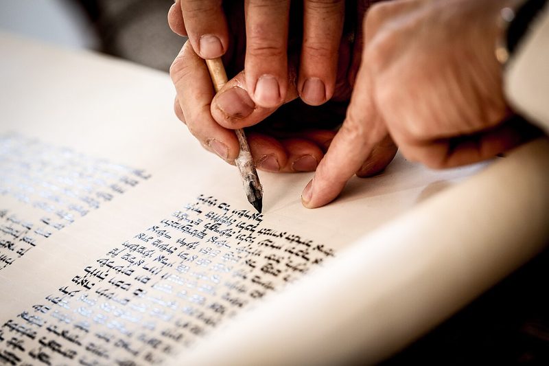 Writing a Torah scroll.