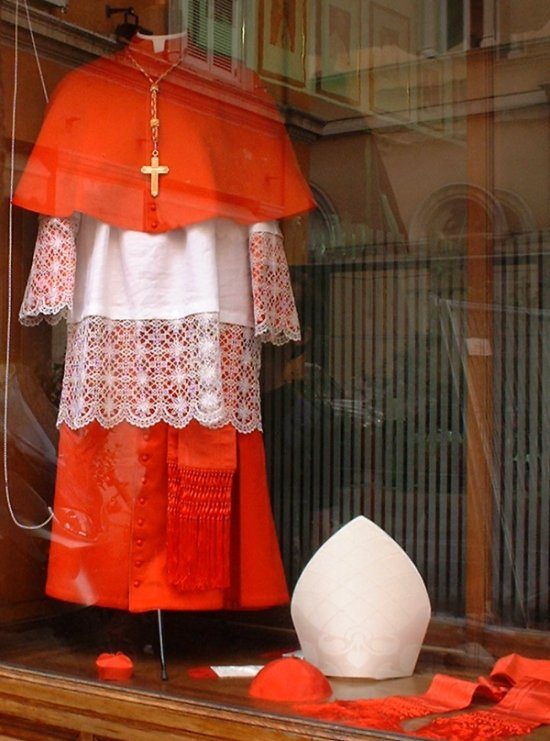 Choir dress of a cardinal. While this dress is commonly associated with moral integrity and authority, it reminds the victims of clerical abuse of their terrible suffering they have experienced at the hands of those who wore it.