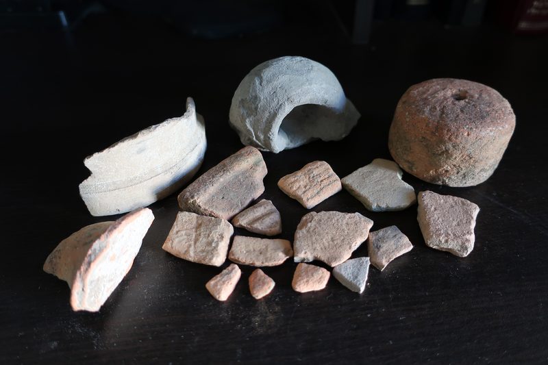 Potsherds and loom-weight found at archaeological sites in Israel.