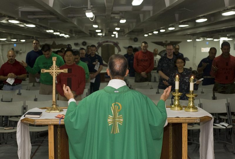 Priest preaching in front of his flock. The investigations of clerical child abuse have revealed a dark side of the Church's power and authority, showing how it has been used to protect abusers rather than safeguarding the vulnerable. It exposed that the Church holds only one thing as truly sacred: itself, rather than the victims.