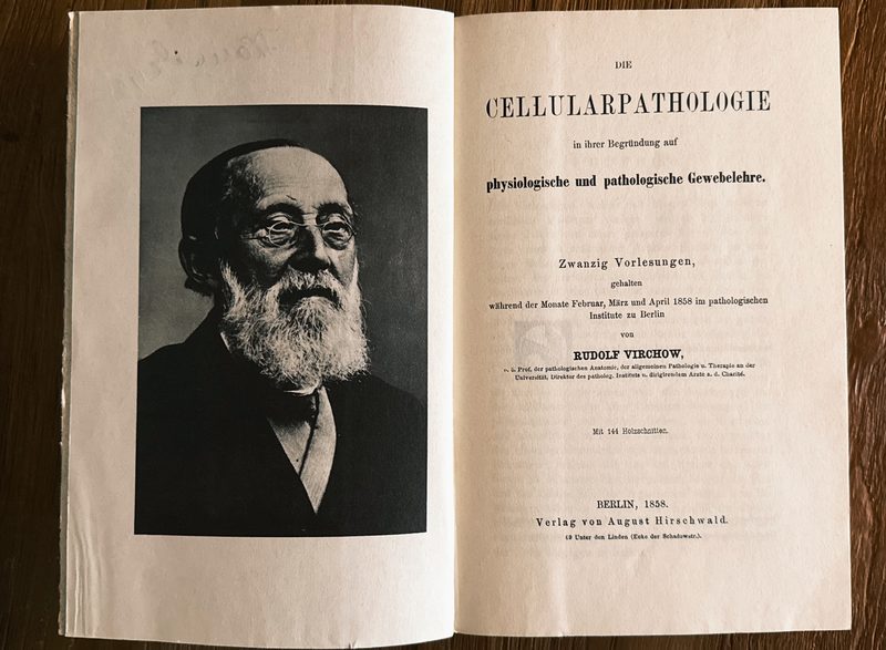 First pages of Virchow's Cellularpathologie, with a photograph of Virchow himself on the left.