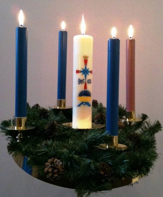 Advent wreath with a pink candle for Gaudete Sunday.