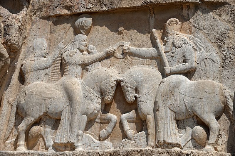 Ahura Mazda (on the right, with high crown) presents Ardashir I (left) with the ring of kingship. (Naqsh-e Rostam, 3rd century CE).