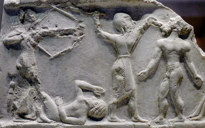 Akkadian soldiers slaying enemies, circa 2300 BCE, possibly from a Victory Stele of Rimush.