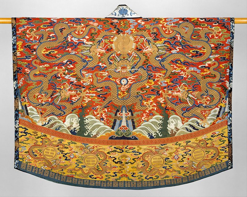Daoist Robe, 17th Century. Robe embroidered with 5 dragons hovering over a landscape of mountains and ocean, likely worn by a Daoist priest during ceremonies.