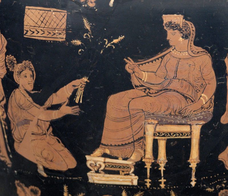 Demeter, enthroned and extending her hand in a benediction toward the kneeling Metaneira, who offers the triune wheat, c. 340 BCE.