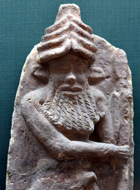 Terracotta wall panel depicting Enkidu, Gilgamesh's friend. He wears a horned helmet and his lower body is bull-like (not shown here). From Ur, Iraq. 2027-1763 BCE.