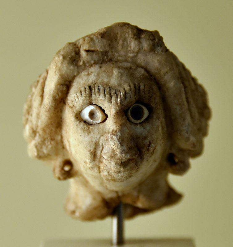 The head of a female statue, dating to the Akkadian period (c. 2334–2154 BCE).