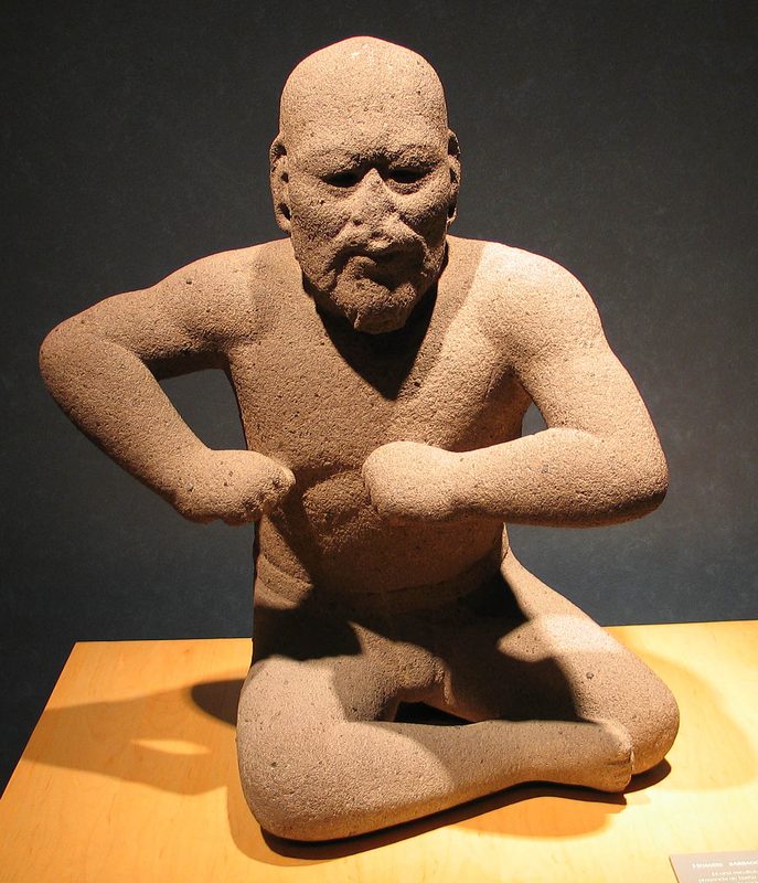 The Wrestler; 1200–400 BCE, basalt, from the Arroyo Sonso area (Veracruz, Mexico). Olmec artists are known for both monumental and miniature portrayals of what are assumed to be persons of authority.
