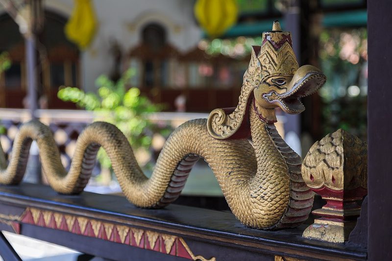 Crowned golden nāga-woodcarving at Keraton Yogyakarta, Java.