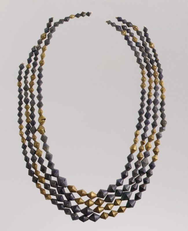 Sumerian necklace beads; 2600–2500 BCE; gold and lapis lazuli.