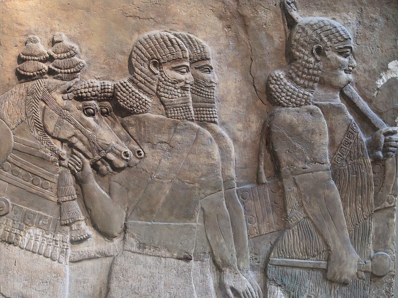 Neo-Assyrian relief of Assyrians in a procession.