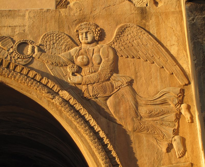 Relief of an angel at Taq-e Bostan, a site with a series of large rock reliefs from the era of the Sassanid Empire of Persia, carved around the 4th century CE.