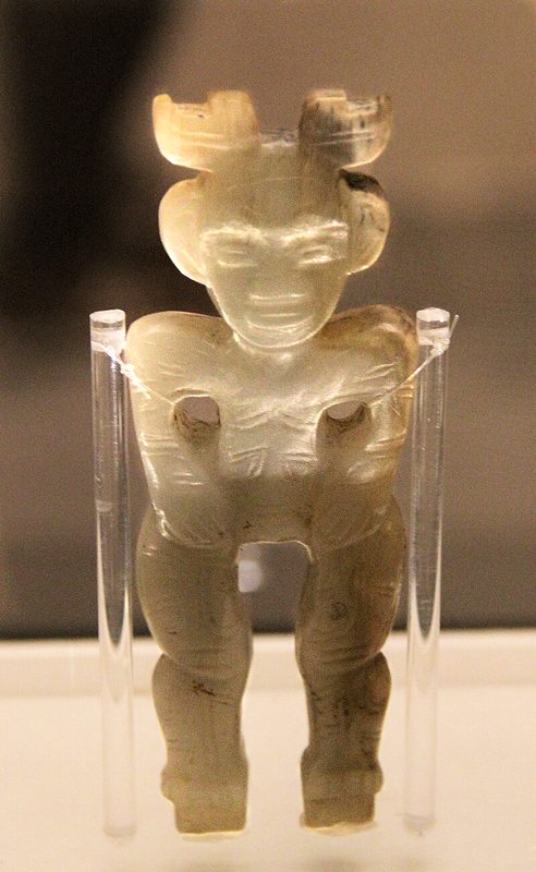 Shang jade human figure, tomb of Fu Hao (died c. 1200 BC). Probably derived from a design of the Seima-Turbino culture.