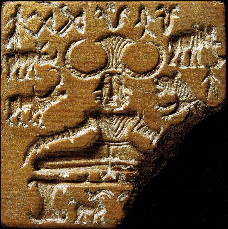 Indus script on a stamp seal depicting a buffalo-horned figure surrounded by animals, dubbed the 'Lord of the Beasts' or 'Paśupati' seal (c. 2350–2000 BCE).