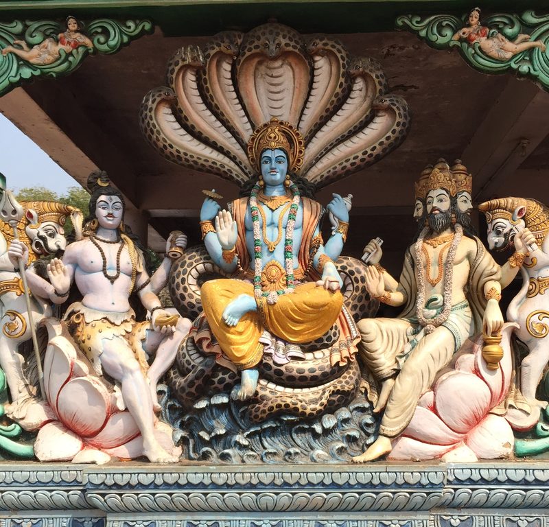 The trinity of supreme divinity (the *trimurti*), from left to right: Shiva, Vishnu, and Brahma.