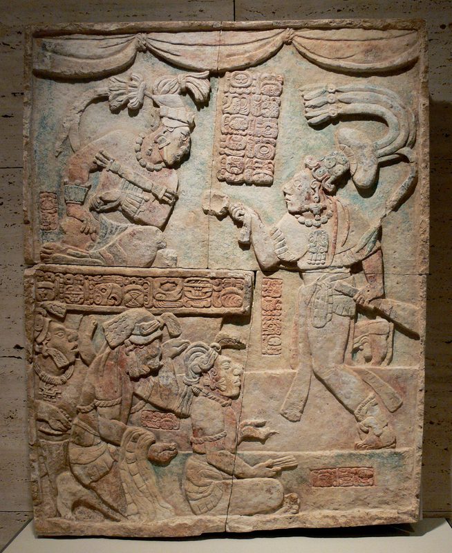 Classic period sculpture showing sajal Aj Chak Maax presenting captives before ruler Itzamnaaj Bʼalam III of Yaxchilan.