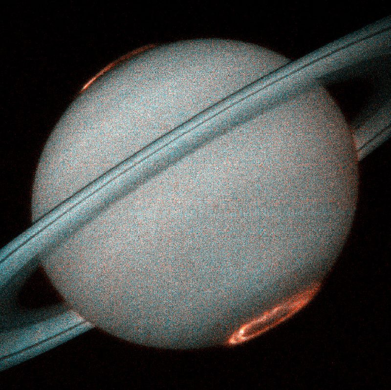 Saturn with ultraviolet Aurorae, photographed in October 1997 by the Hubble Space Telescope's Space Telescope Imaging Spectrograph (STIS) from a distance of 1.3 billion km.