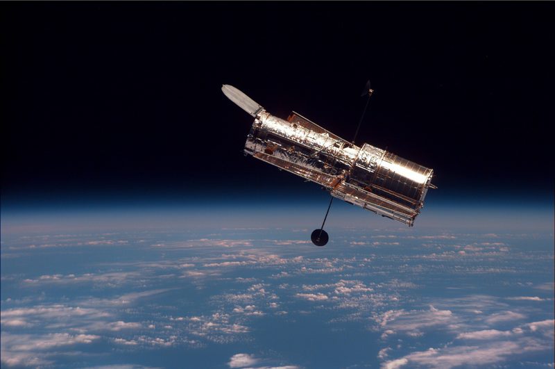 Hubble, as seen from Discovery during its second servicing mission.