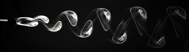 Visualisation of the vortex street behind a circular cylinder in air (on the left).