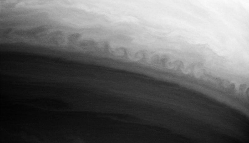 A Kelvin-Helmholtz instability on Saturn, formed at the interaction of two bands of the planet's atmosphere.